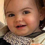 Ambre a rejoint le concours — aidez-le/la à gagner de superbes lots ! child, baby, toddler, face, smile, eyes, hair, pigtails, lace_collar, cardigan, dress, hand, portrait, closeup, indoor, rosy_cheeks, button, sparkle, candid, adorable