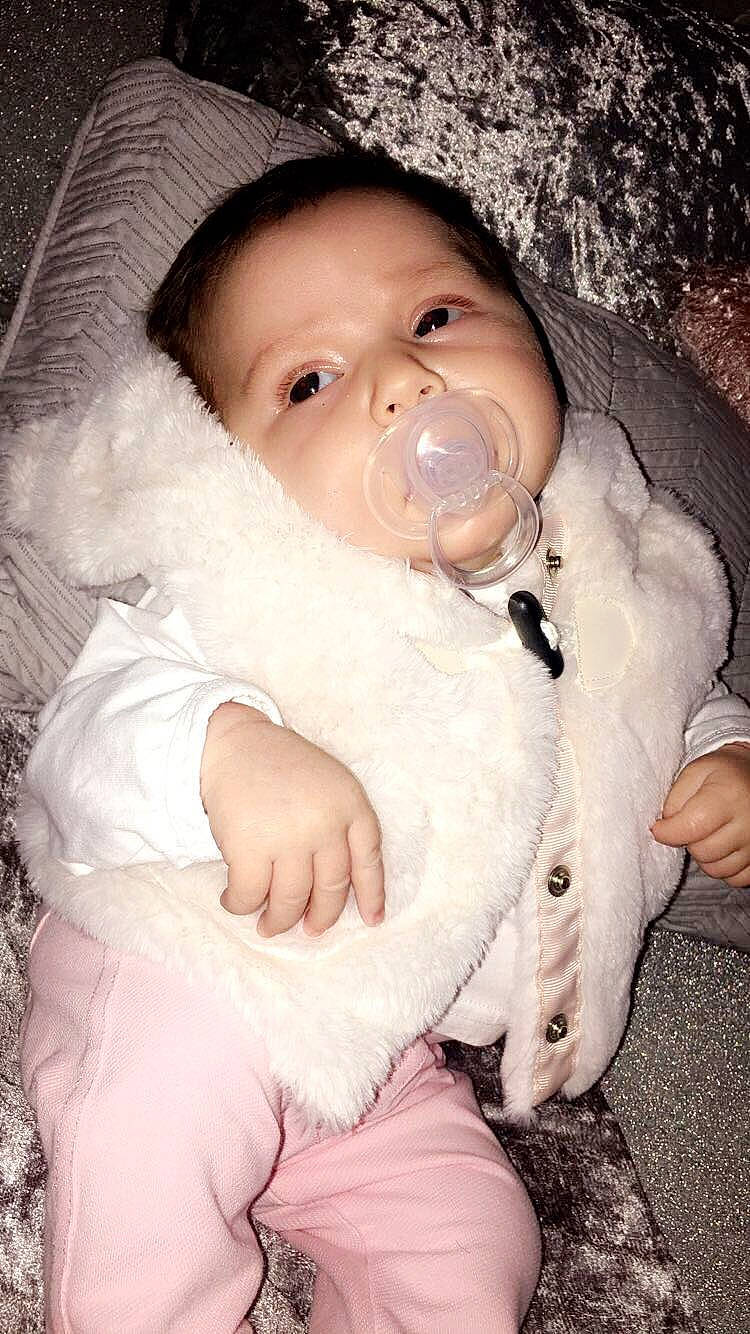 Ellie-mae  is registered to the contest to win money with this photo: baby, child, fur, headwear, nose, person, skin, smile, toddler, trunk