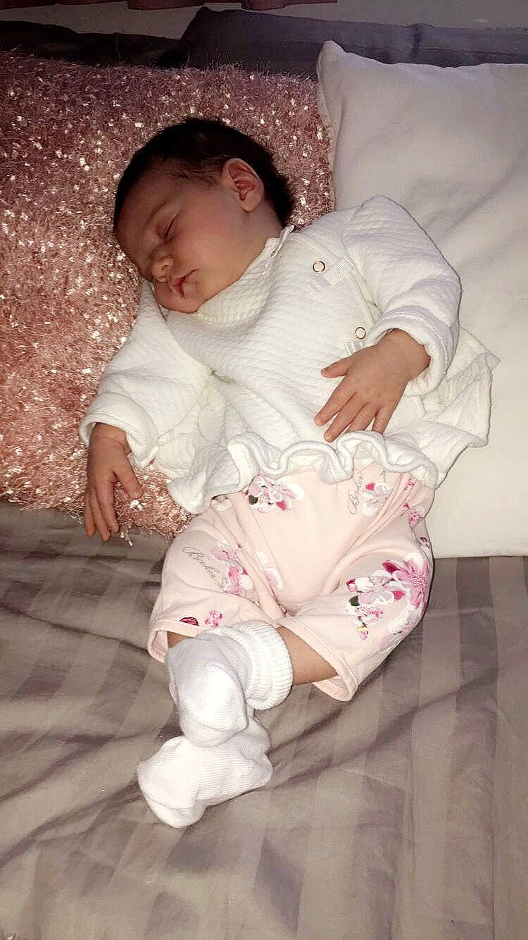 Ellie-mae  is registered to the contest to win money with this photo: baby, baby_toddler_clothing, child, person, pink, sitting, skin, toddler, white