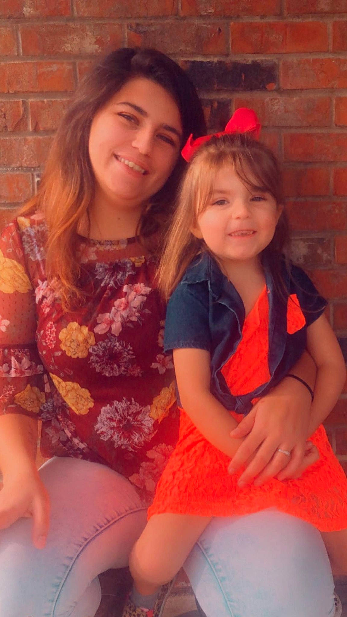 Makinzie is registered to the contest to win money with this photo: baby_toddler_clothing, brick, brickwork, brown_hair, facial_expression, fun, hand, happy, human_leg, joy, lap, laugh, mouth, one_piece_garment, person, smile, sock, thigh, throat, tooth