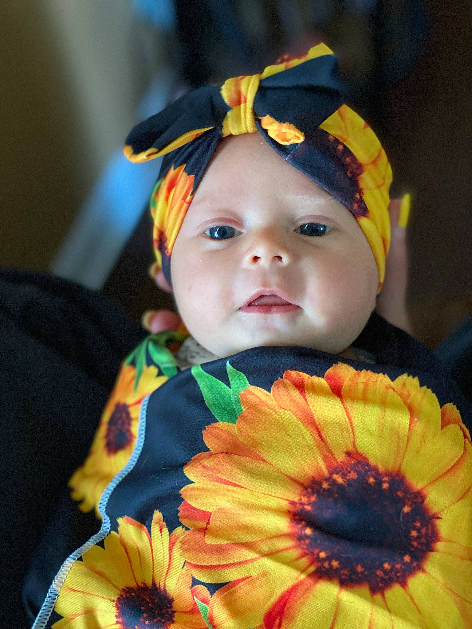 Adalynn is registered to the contest to win money with this photo: baby, baby_toddler_clothing, cap, child, costume_hat, event, eye, face, fashion_accessory, flower, happy, hat, headgear, headwear, orange, pattern, person, petal, plant, t_shirt