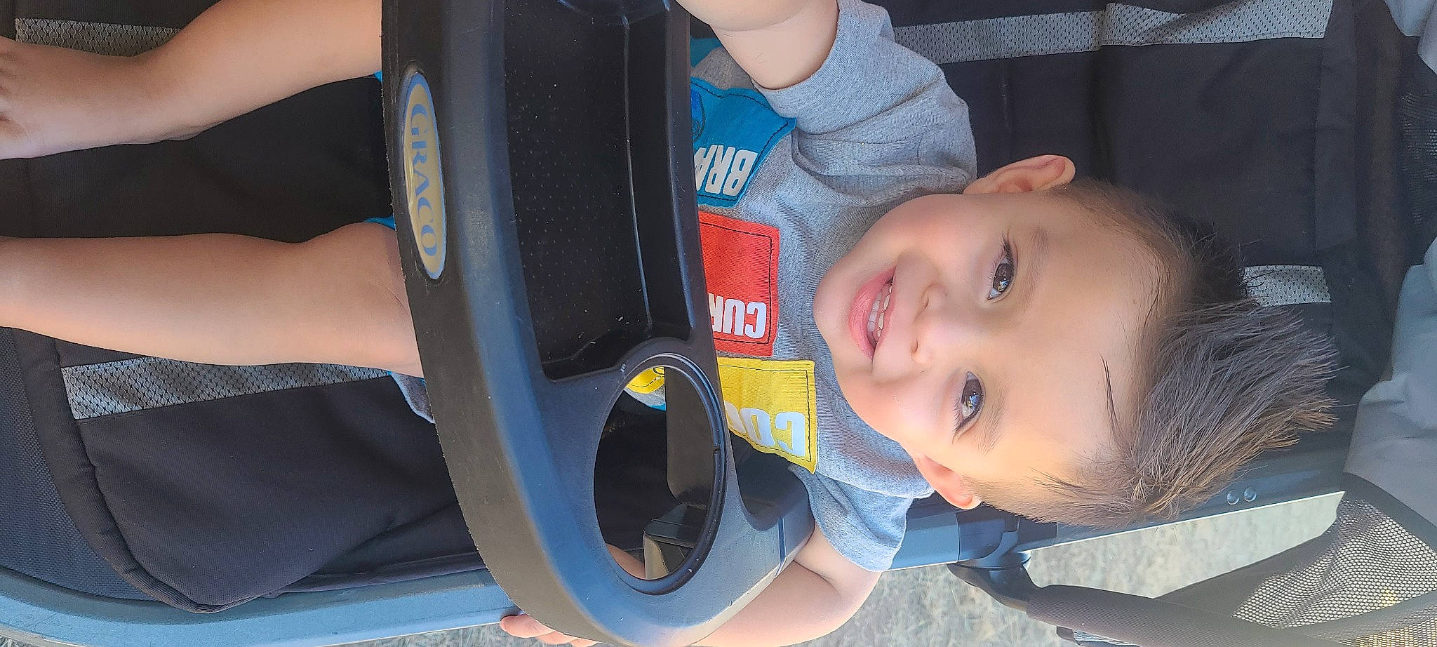 Dominik is registered to the contest to win money with this photo: audio_equipment, auto_part, automotive_exterior, automotive_tire, baby_toddler_clothing, bumper, car_seat, child, electric_blue, fun, hairstyle, happy, iris, joy, leisure, person, sitting, smile, steering_wheel, toddler
