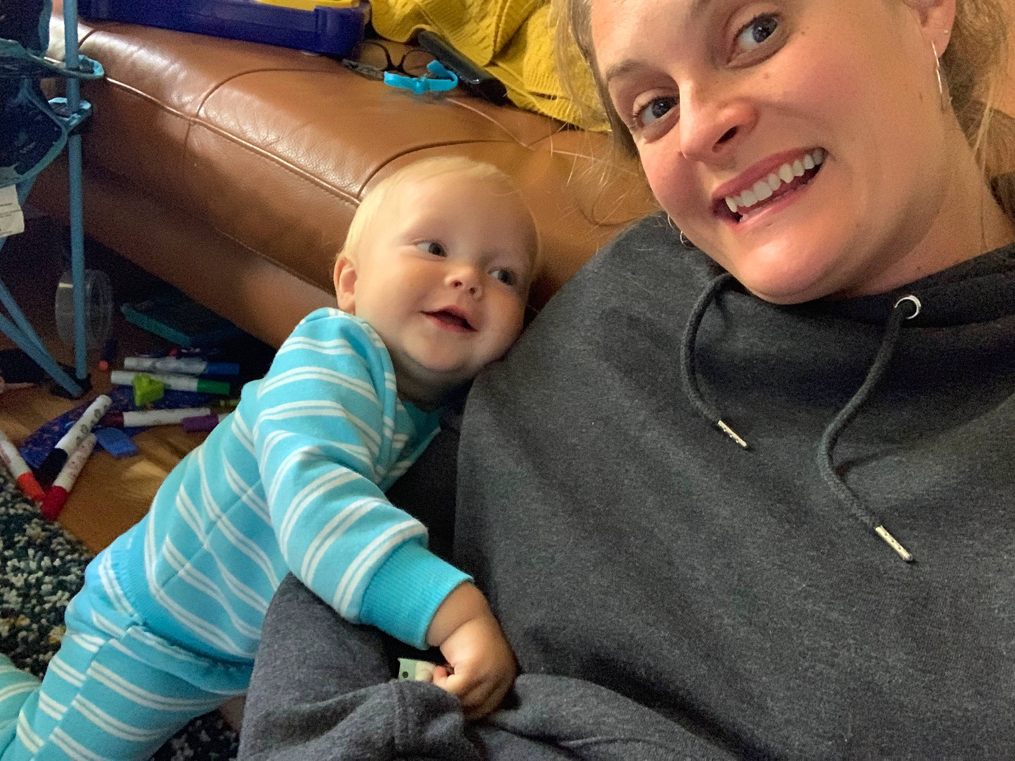 Sonny is registered to the contest to win money with this photo: baby, baby_toddler_clothing, child, eye, facial_expression, flooring, fun, happy, head, headwear, joy, lap, laugh, leisure, person, play, sitting, skin, smile, standing