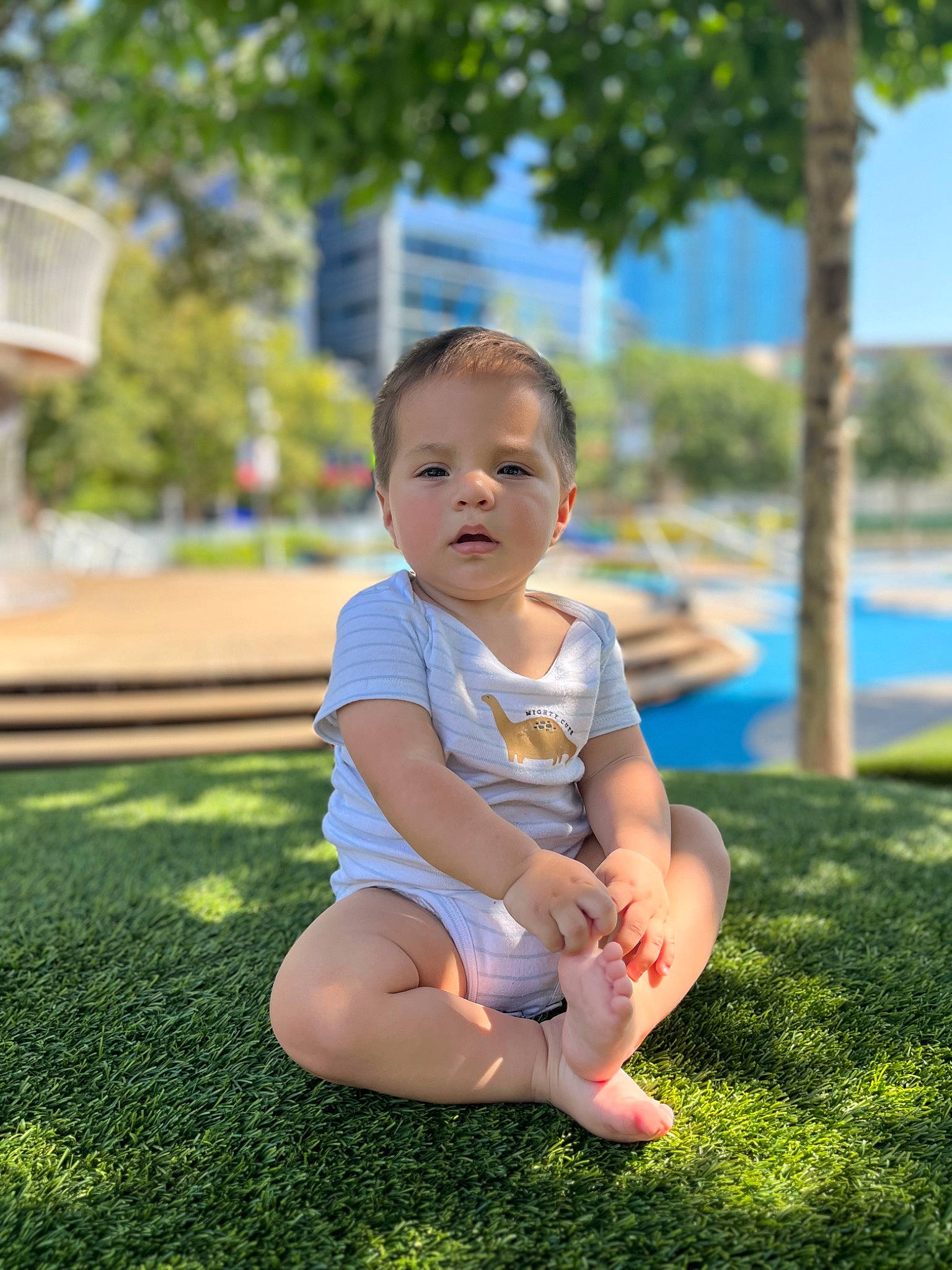Jacob joined the competition — help win amazing prizes! baby, baby_toddler_clothing, barefoot, child, flash_photography, fun, grass, happy, human_leg, lawn, leisure, people_in_nature, person, plant, recreation, shorts, sitting, sky, t_shirt, toddler