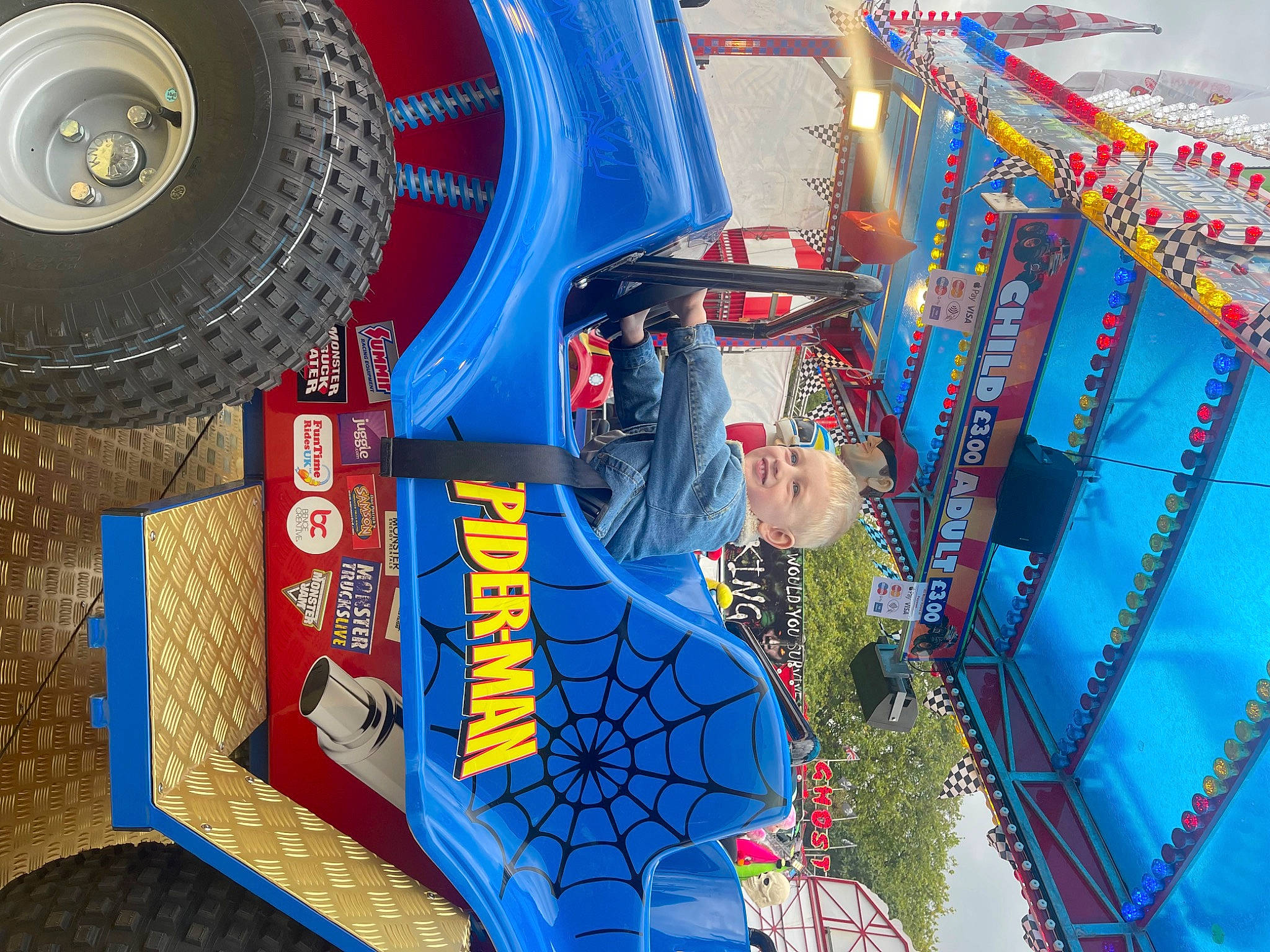 Sebastian is registered to the contest to win money with this photo: automotive_exterior, automotive_tire, blue, electric_blue, event, fun, hubcap, joy, leisure, machine, motor_vehicle, person, recreation, rim, synthetic_rubber, textile, tire, tire_care, tread, vehicle