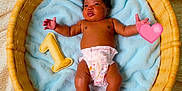 Essence is registered to the contest to win money with this photo: baby, basket, blanket, blue_blanket, child, cute, diaper, face, foot, hand, heart_emoji, indoor, infant, lying_down, newborn, number_one, plush_toy, skin, soft_texture, wicker