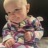 Dakota joined the competition — help win amazing prizes! baby, child, infant, portrait, smile, face, clothing, patterned_outfit, sitting, cute, young_child, skin, head, eyes, hand, indoors, expression, colorful, fabric, background