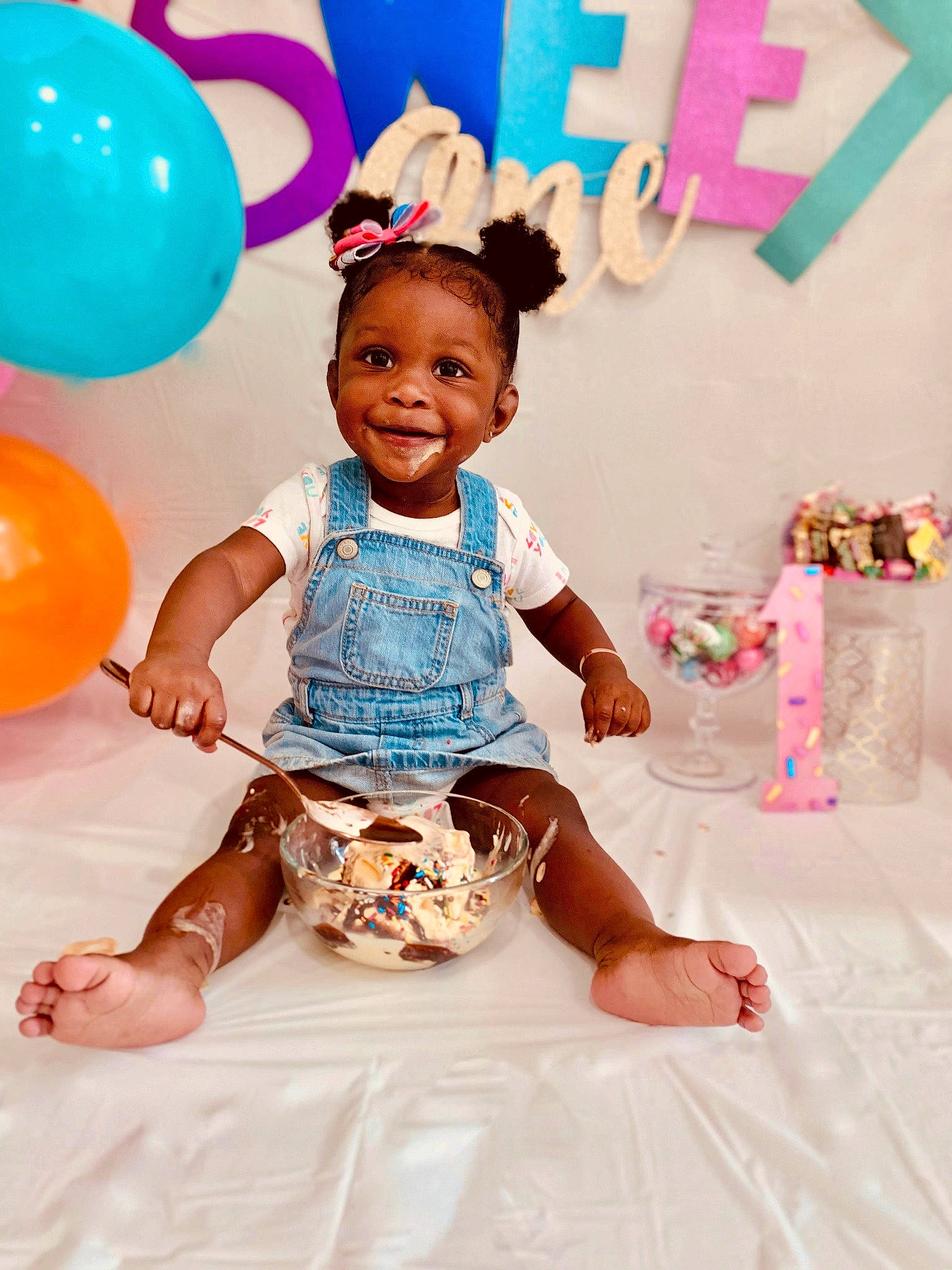 Monroe is registered to the contest to win money with this photo: baby, baby_toddler_clothing, balloon, birthday, birthday_party, child, event, fun, happy, head, joy, leg, leisure, magenta, party_supply, person, pink, shorts, smile, t_shirt
