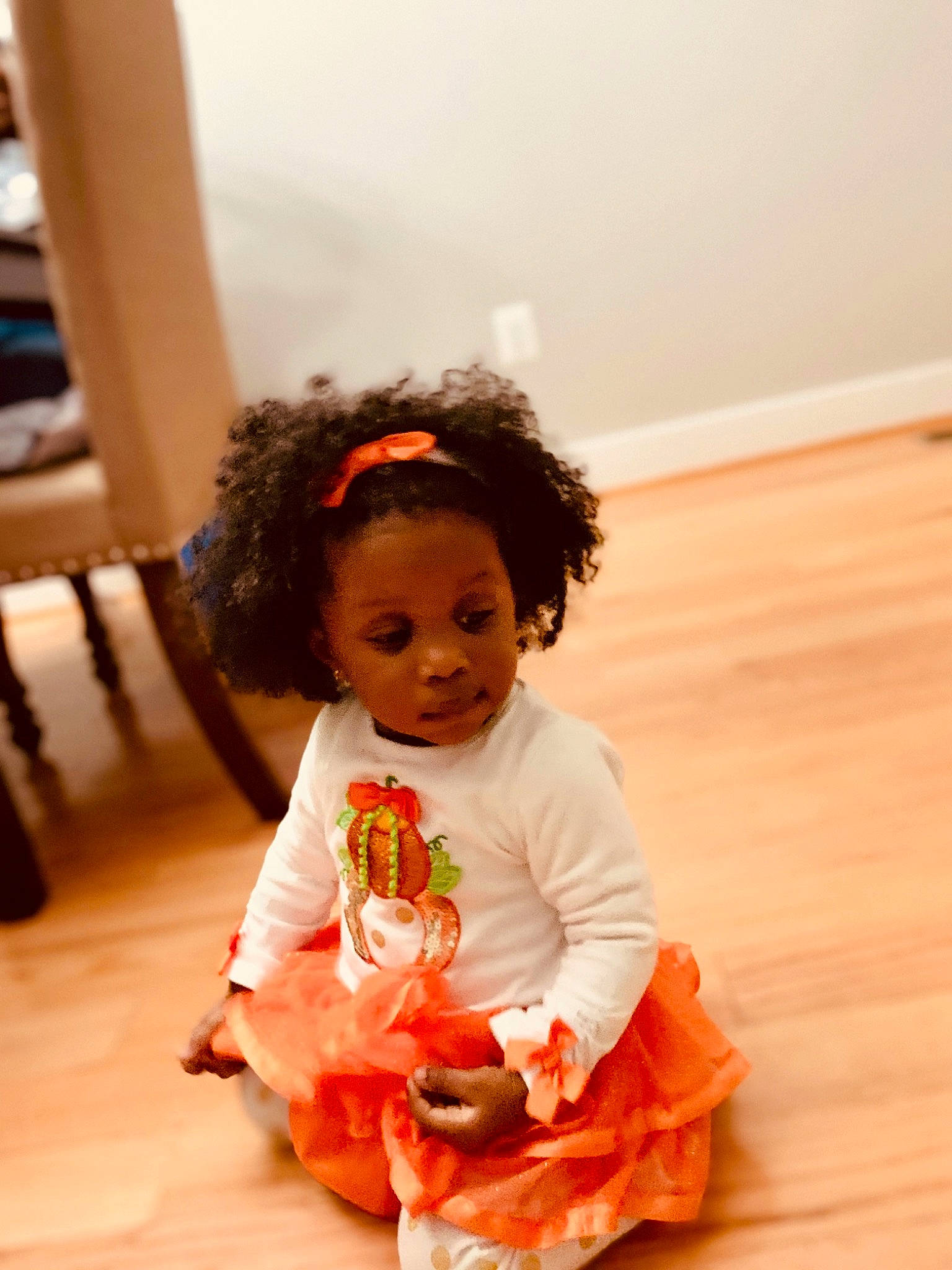Monroe joined the competition — help win amazing prizes! baby, baby_toddler_clothing, child, floor, flooring, fun, happy, hardwood, laminate_flooring, orange, peach, person, play, room, sitting, skin, sleeve, sock, toddler, wood
