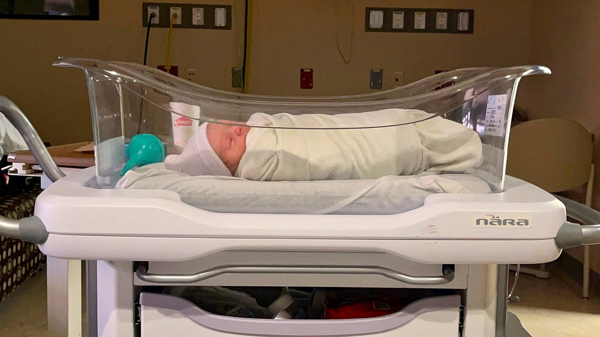 Brandon Jr is registered to the contest to win money with this photo: baby_safety, bed, comfort, drawer, event, headwear, health_care, hospital, hospital_bed, linens, machine, medical, medical_equipment, metal, person, personal_care, rectangle, room, service, shelf