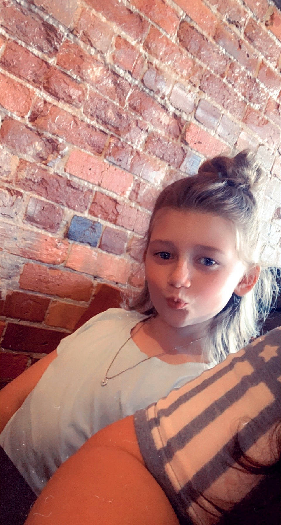 Peyton joined the competition — help win amazing prizes! brick, brickwork, brown_hair, child, cool, eyebrow, eyelash, fashion_design, flash_photography, happy, jewellery, lip, long_hair, neck, pattern, person, photograph, portrait_photography, shoulder, sitting