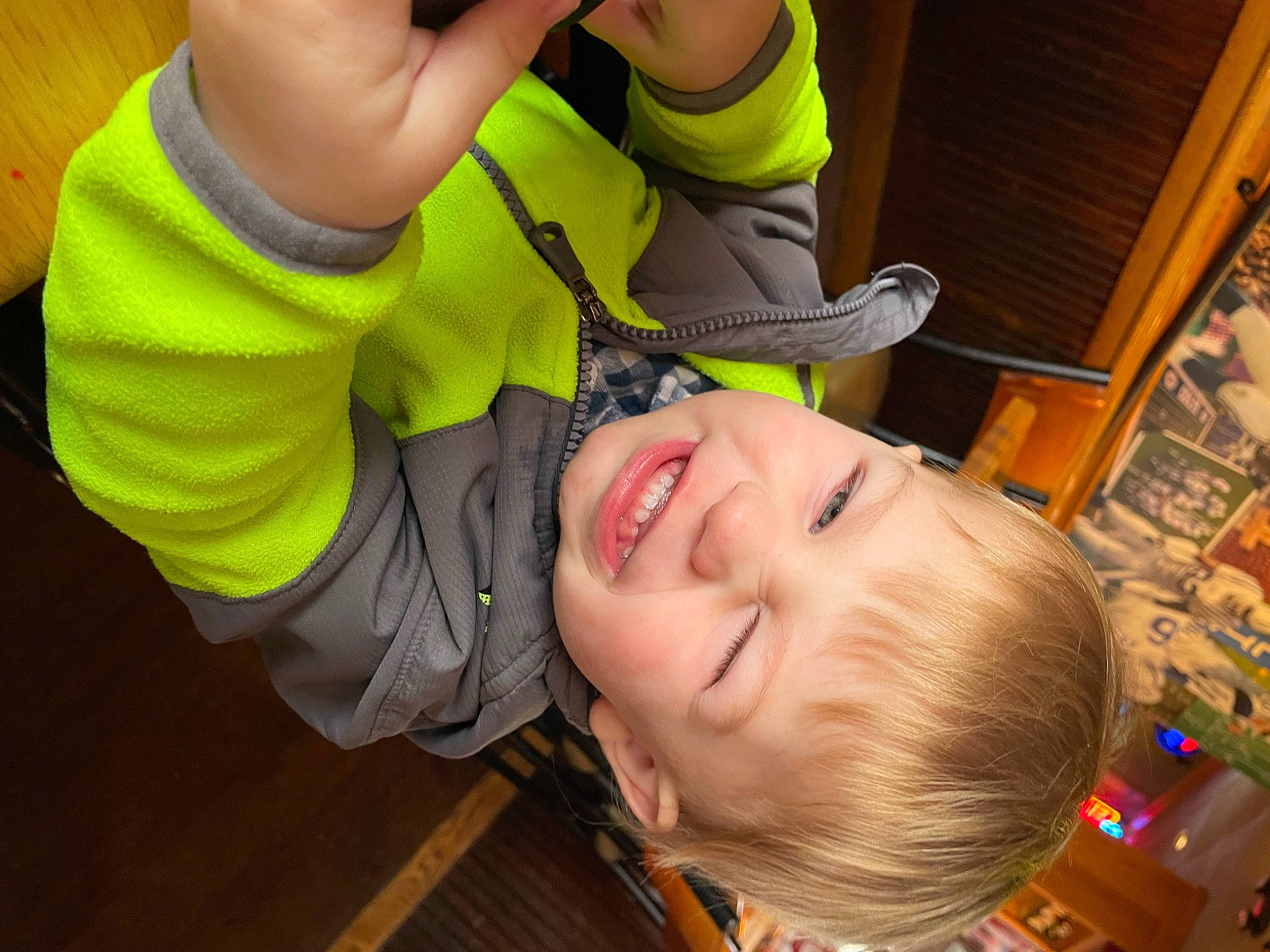 Nash is registered to the contest to win money with this photo: baby, baby_laughing, baby_products, cheek, child, flooring, fun, gesture, grass, happy, laugh, leisure, mouth, nose, person, play, smile, t_shirt, toddler, wood