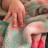 Nova Rios joined the competition — help win amazing prizes! baby_hand, infant, fingers, gesture, peace_sign, blanket, soft_texture, pastel_colors, pink, teal, close_up, skin, nails, cute, resting, cozy, warm, child, baby, toddler