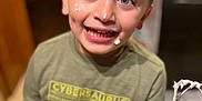 Mason is registered to the contest to win money with this photo: child, boy, smiling, whipped_cream, face_cream, kitchen, mixer_beater, green_shirt, messy_face, happy, indoor, cooking, baking, playful, young, person, portrait, short_hair, light, home