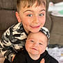 Mason joined the competition — help win amazing prizes! child, baby, smile, face, couch, clothing, dimples, portrait, indoor, happy, sitting, person, cute, young, light, hair, eyes, infant, sibling, cozy