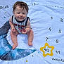 Matthew joined the competition — help win amazing prizes! baby, child, milestone_blanket, moon, stars, numbers, months, usa, prop, smiling, sitting, clothing, indoor, cute, happy, infant, portrait, celebration, young_child, blanket