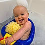 Audrey is registered to the contest to win money with this photo: baby, bathtub, foam, bubble, bath_toy, yellow, blue, smiling, child, water, bathroom, happy, skin, toddler, toy, playful, cute, sitting, head, hand