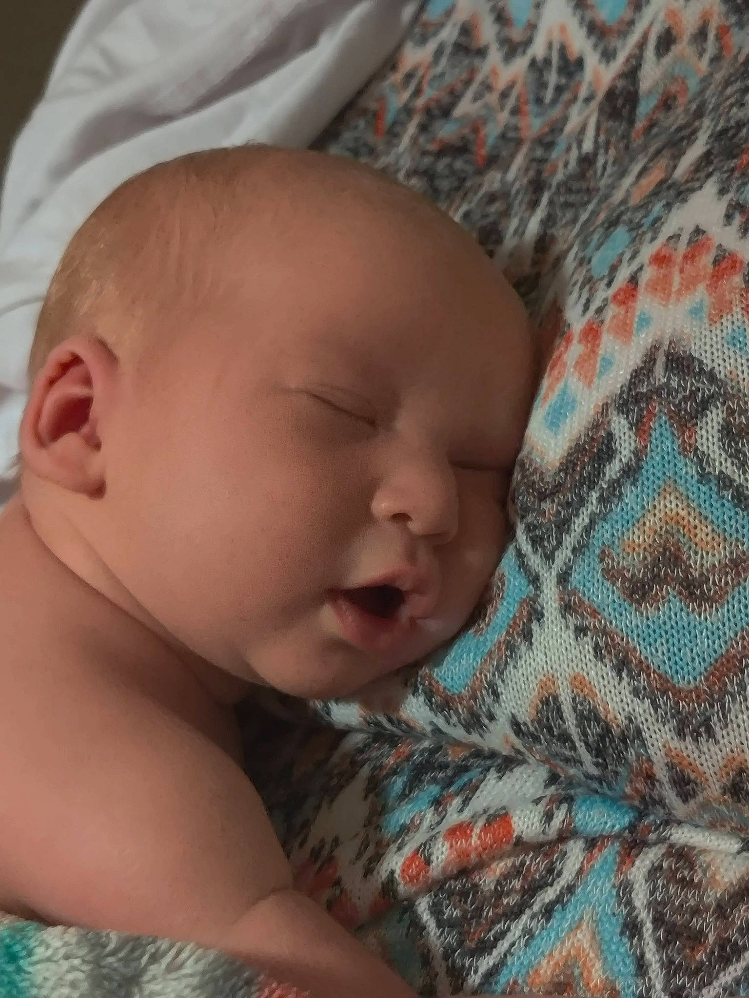 Aleena is registered to the contest to win money with this photo: baby, baby_toddler_clothing, bedtime, cheek, chin, close_up, comfort, eye, eyebrow, happy, human, iris, linens, lip, mammal, mouth, nose, pattern, person, skin