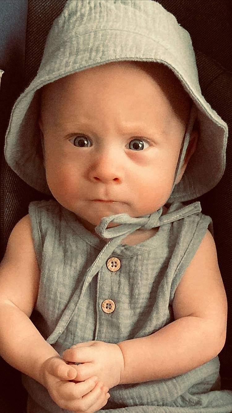 Andy joined the competition — help win amazing prizes! baby, baby_toddler_clothing, cap, cheek, chin, clothing, eye, eyebrow, face, facial_expression, gesture, headgear, headwear, iris, lip, nose, organ, outerwear, person, photograph