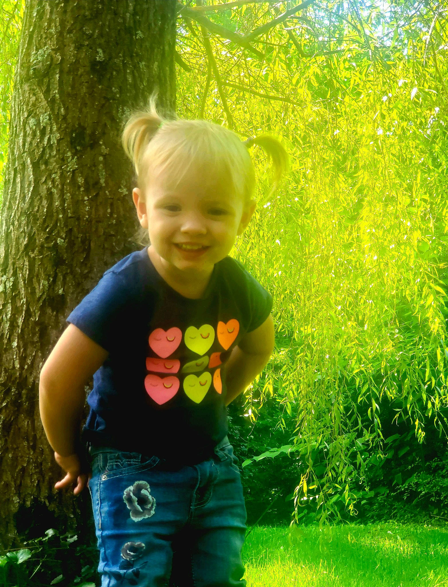 Amiya joined the competition — help win amazing prizes! baby_toddler_clothing, clothing, fun, grass, green, happy, joy, leaf, natural_landscape, people_in_nature, person, plant, smile, standing, summer, sunlight, t_shirt, terrestrial_plant, tints_and_shades, toddler