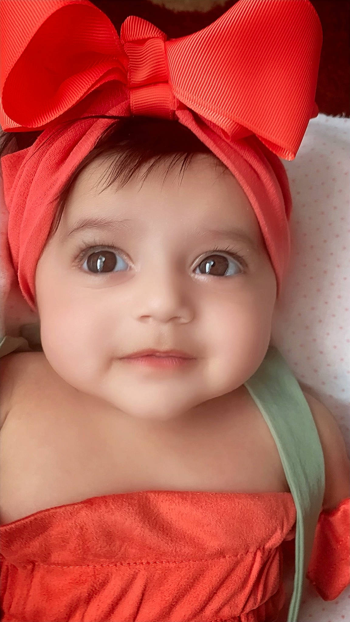 Amaira is registered to the contest to win money with this photo: baby, cheek, child, child_model, chin, close_up, eye, face, head, headgear, headwear, lip, mouth, nose, peach, person, pink, portrait_photography, red, skin
