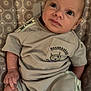 baby, infant, child, toy_story, clothing, socks, seat, pattern, cute, portrait, small, human, person, apparel, fabric, relaxed, indoors, skin, face, hand