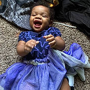 Khloe Grace joined the competition — help win amazing prizes! toddler, child, laughing, purple_dress, carpet, blanket, fabric, happy, indoor, person, smile, playful, clothing, cute, infant, joy, baby, portrait, fun, skin