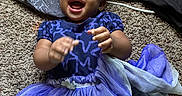 Khloe Grace is registered to the contest to win money with this photo: baby, blanket, blue_dress, carpet, child, closeup, clothing, cute, fabric, hands, happy, indoor, infant, joyful, laughing, person, playful, portrait, smiling, toddler