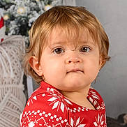 Kelya participe au concours pour gagner de l'argent avec cette photo : toddler, child, face, portrait, holiday, christmas, sweater, red_clothing, brown_hair, indoors, decor, candy_cane, festive, cute, expression, curious, soft_lighting, closeup, person, winter