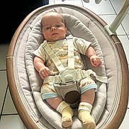 Oliver joined the competition — help win amazing prizes! baby, infant, child, bouncer, baby_seat, harness, toy, elephant_toy, portrait, lying_down, indoor, tiled_floor, nursery, clothing, onesie, socks, smiling, face, furniture, safe