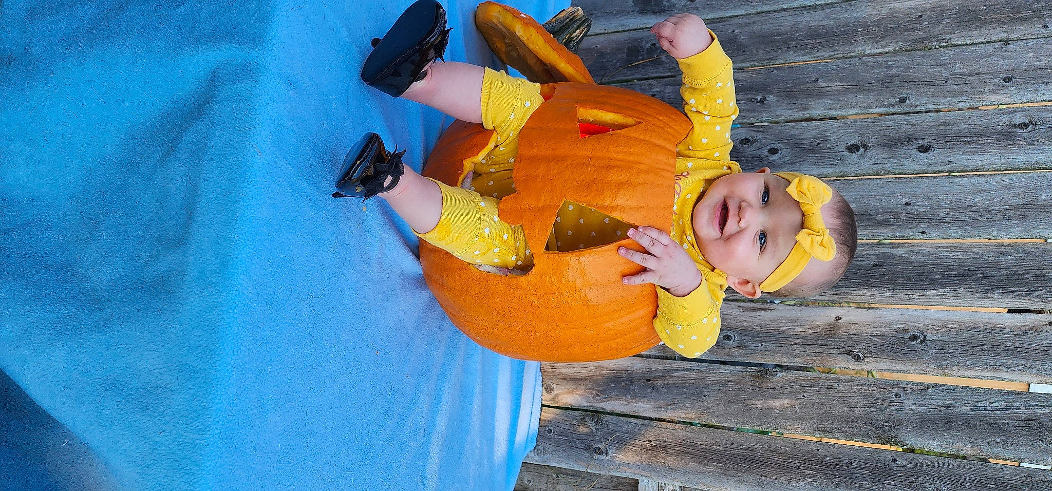 Amoura is registered to the contest to win money with this photo: calabaza, child, cucurbita, electric_blue, fun, gesture, gourd, happy, hat, headwear, joy, leisure, orange, people_in_nature, person, plant, pumpkin, smile, squash, toddler