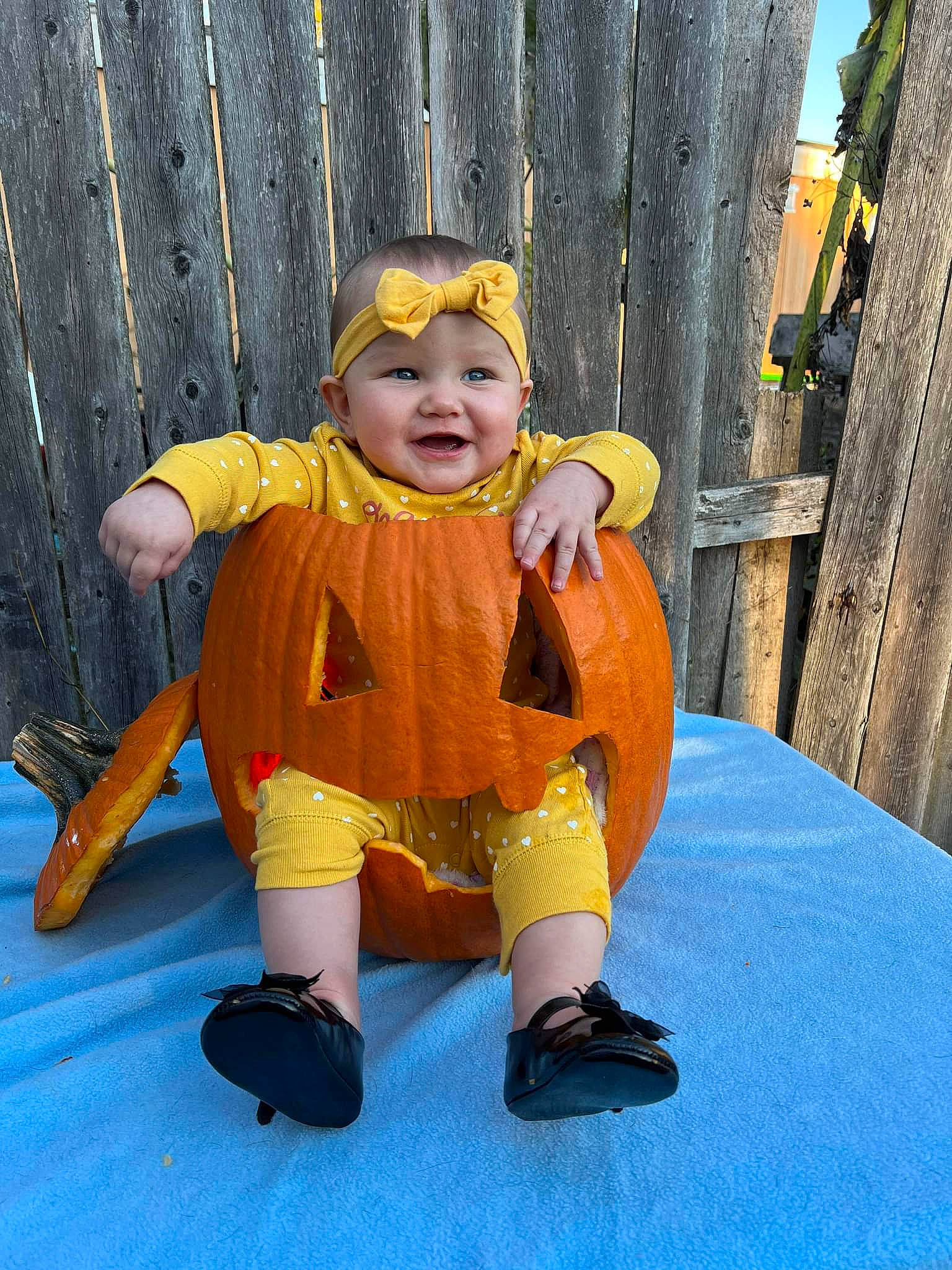 Amoura is registered to the contest to win money with this photo: baby, baby_toddler_clothing, child, costume, electric_blue, eye, face, fictional_character, flooring, fun, happy, hat, headwear, leisure, orange, person, personal_protective_equipment, recreation, sleeve, smile