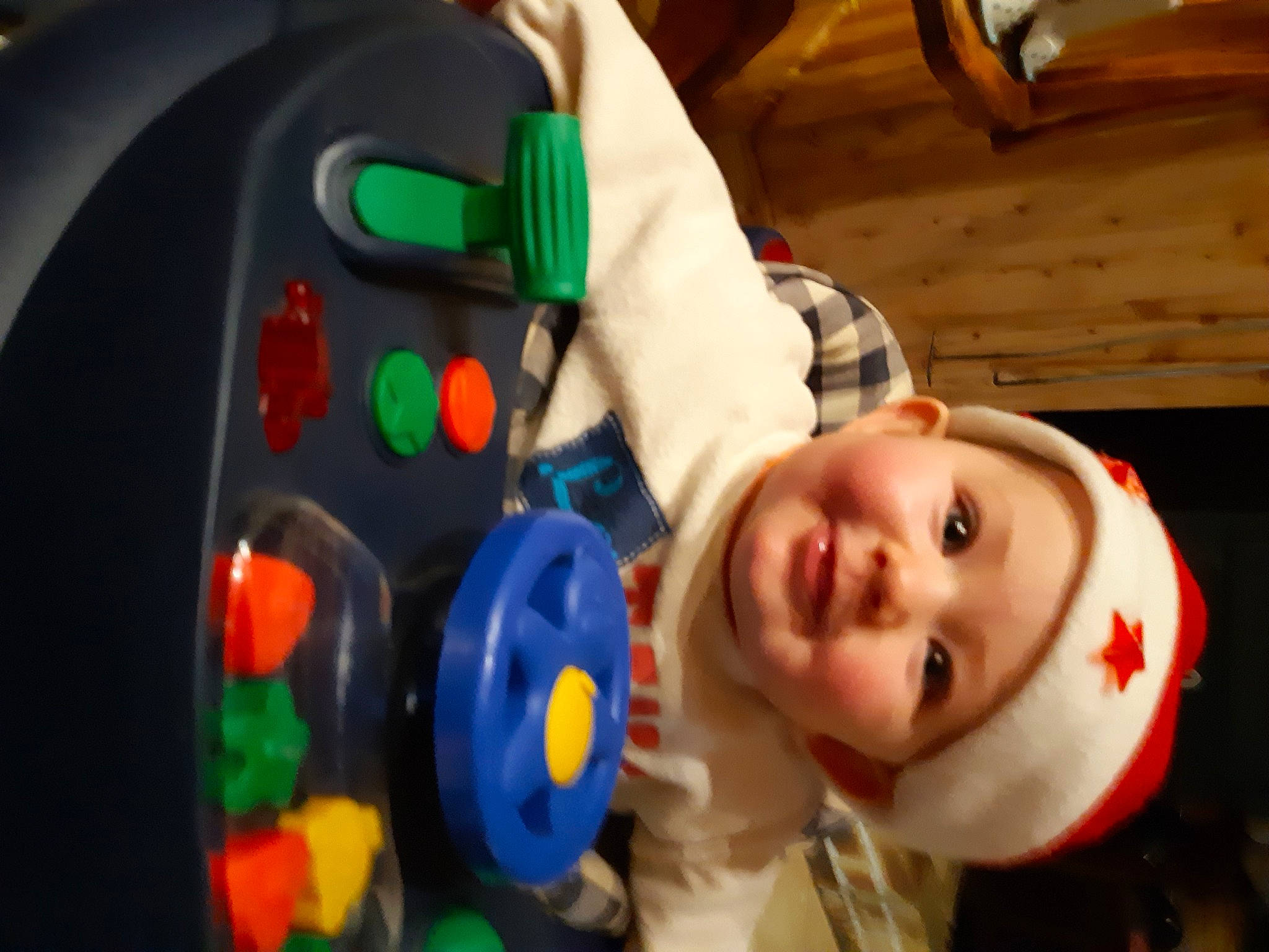 Emilie participe au concours pour gagner de l'argent avec cette photo : audio_equipment, auto_part, baby, baby_products, baby_toys, child, eye, fun, happy, headwear, joy, leisure, nose, person, plastic, play, smile, steering_wheel, toddler, toy