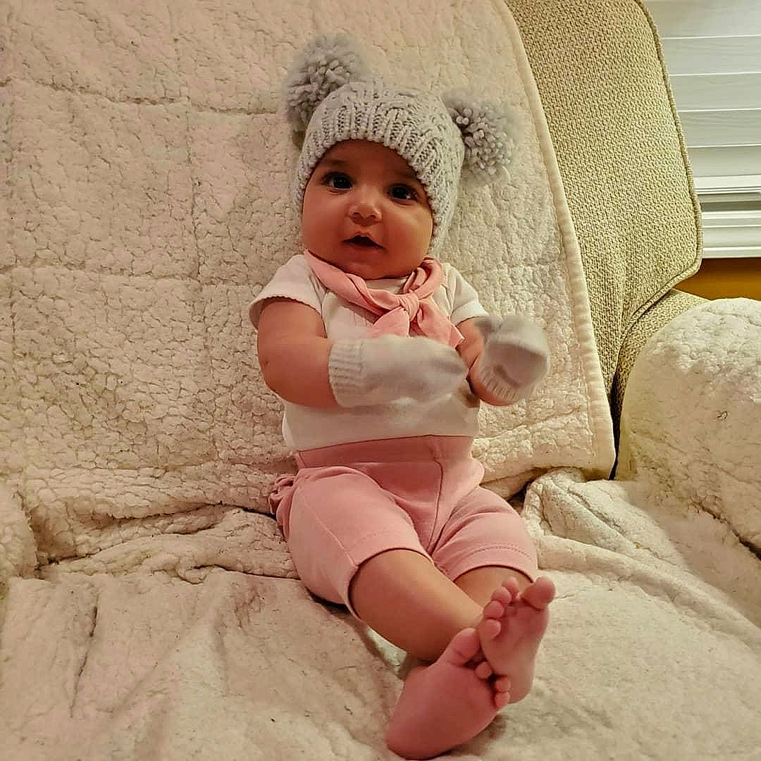 Gracie is registered to the contest to win money with this photo: baby, baby_sleeping, baby_toddler_clothing, blond, child, comfort, eye, foot, head, headwear, human_leg, knee, leg, linens, lip, person, skin, sleeve, stomach, textile