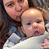 Laura is registered to the contest to win money with this photo: baby, woman, face, closeup, outdoor, tree_bark, baby_carrier, affection, skin, person, nature, portrait, expression, child, holding, hair, love, family, parent, candid