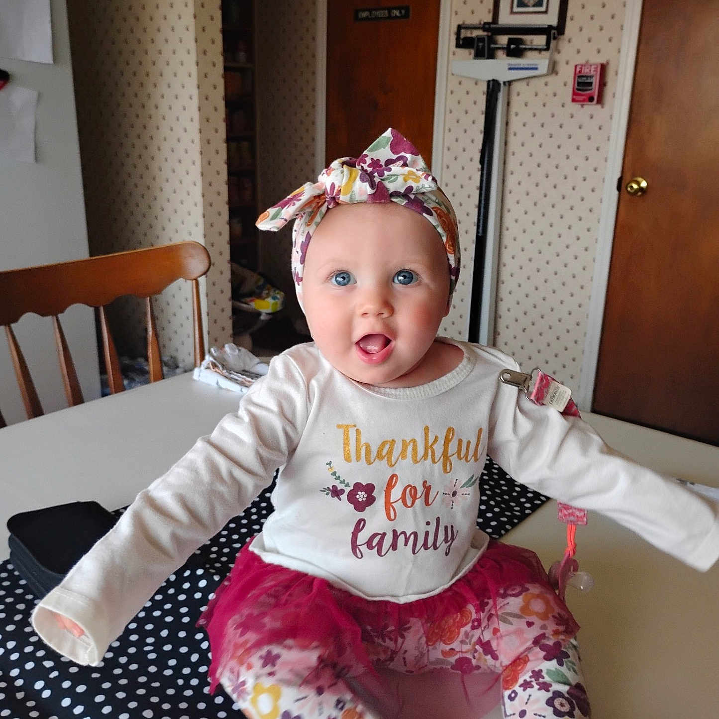 Lilah is registered to the contest to win money with this photo: architecture, baby, building, chair, clothing, couch, face, furniture, hat, head, hosiery, indoors, livingroom, pants, person, photography, portrait, room, sitting, wood