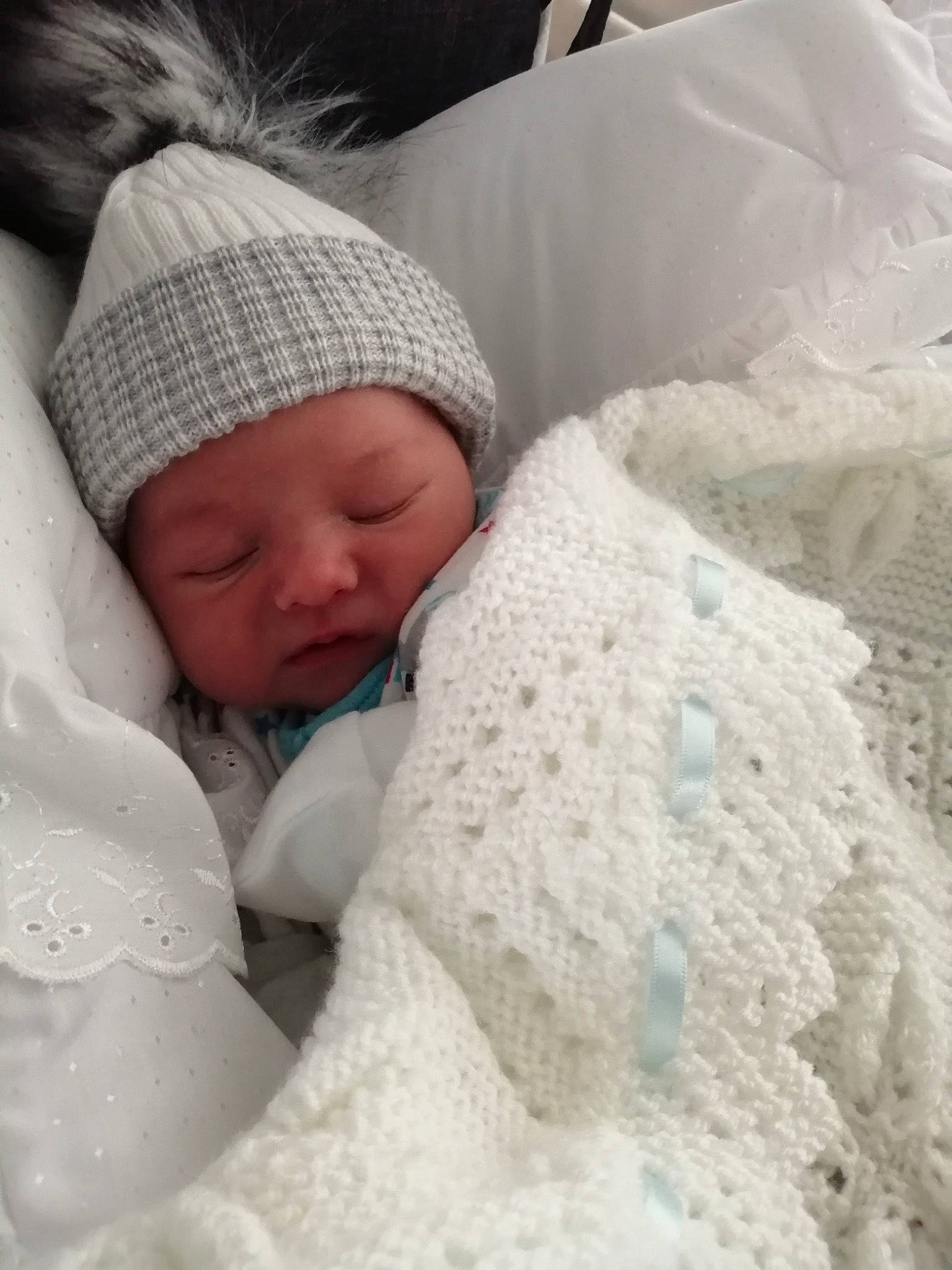 Kobi joined the competition — help win amazing prizes! baby, baby_sleeping, bedding, bedtime, blanket, bonnet, child, headgear, headwear, knitting, linens, person, skin, sleep, textile, toddler, wool