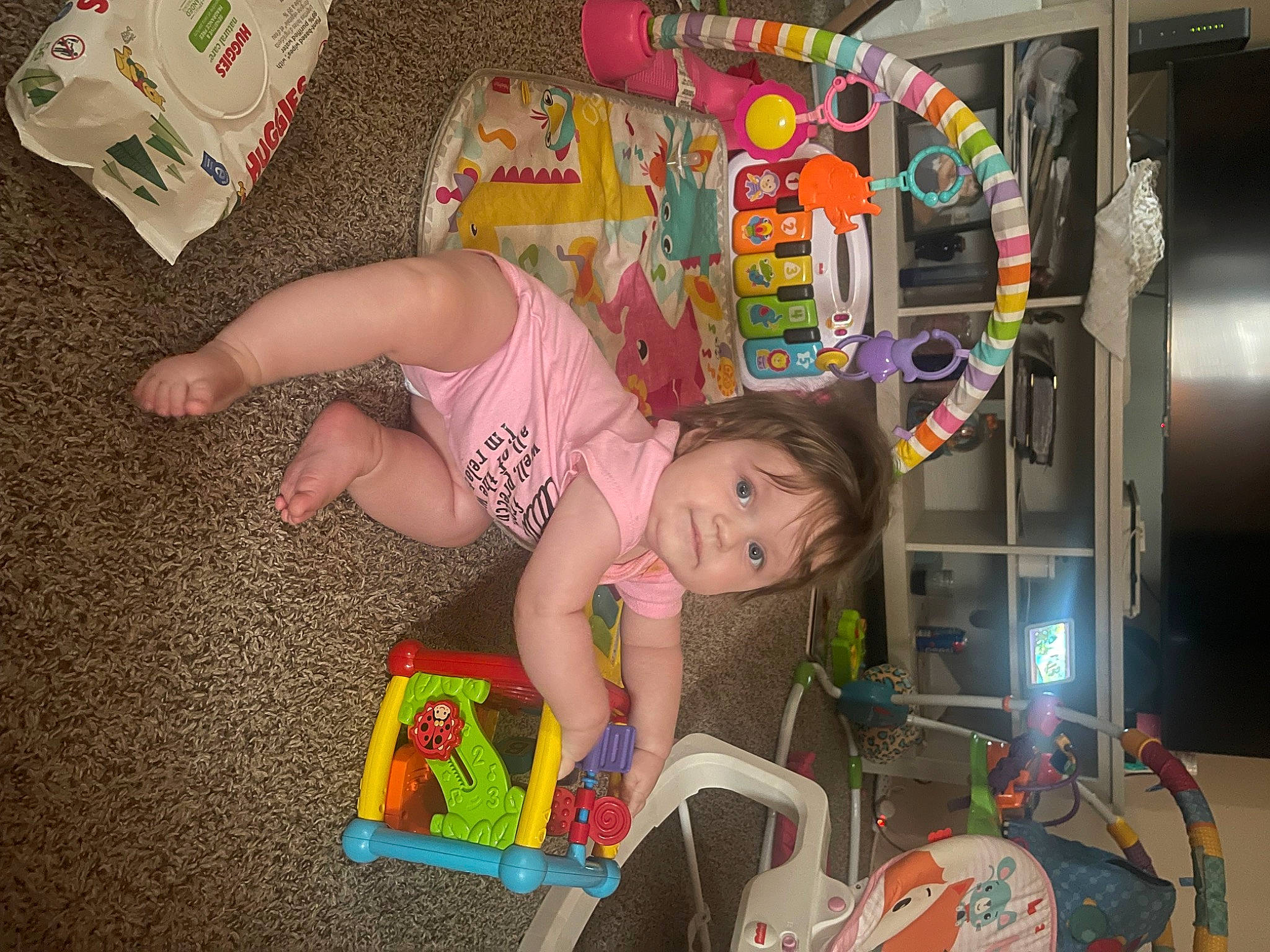Aubrey is registered to the contest to win money with this photo: baby, baby_products, baby_toys, child, eye, flooring, fun, happy, leisure, machine, person, play, riding_toy, room, thigh, tire, toddler, toy, toy_vehicle, visual_arts