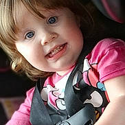 Arianna is registered to the contest to win money with this photo: toddler, child, car_seat, seatbelt, pink_shirt, blue_eyes, smiling, sitting, indoors, safety, cute, young_child, person, portrait, happy, hair, clothing, baby, car_interior, child_seat