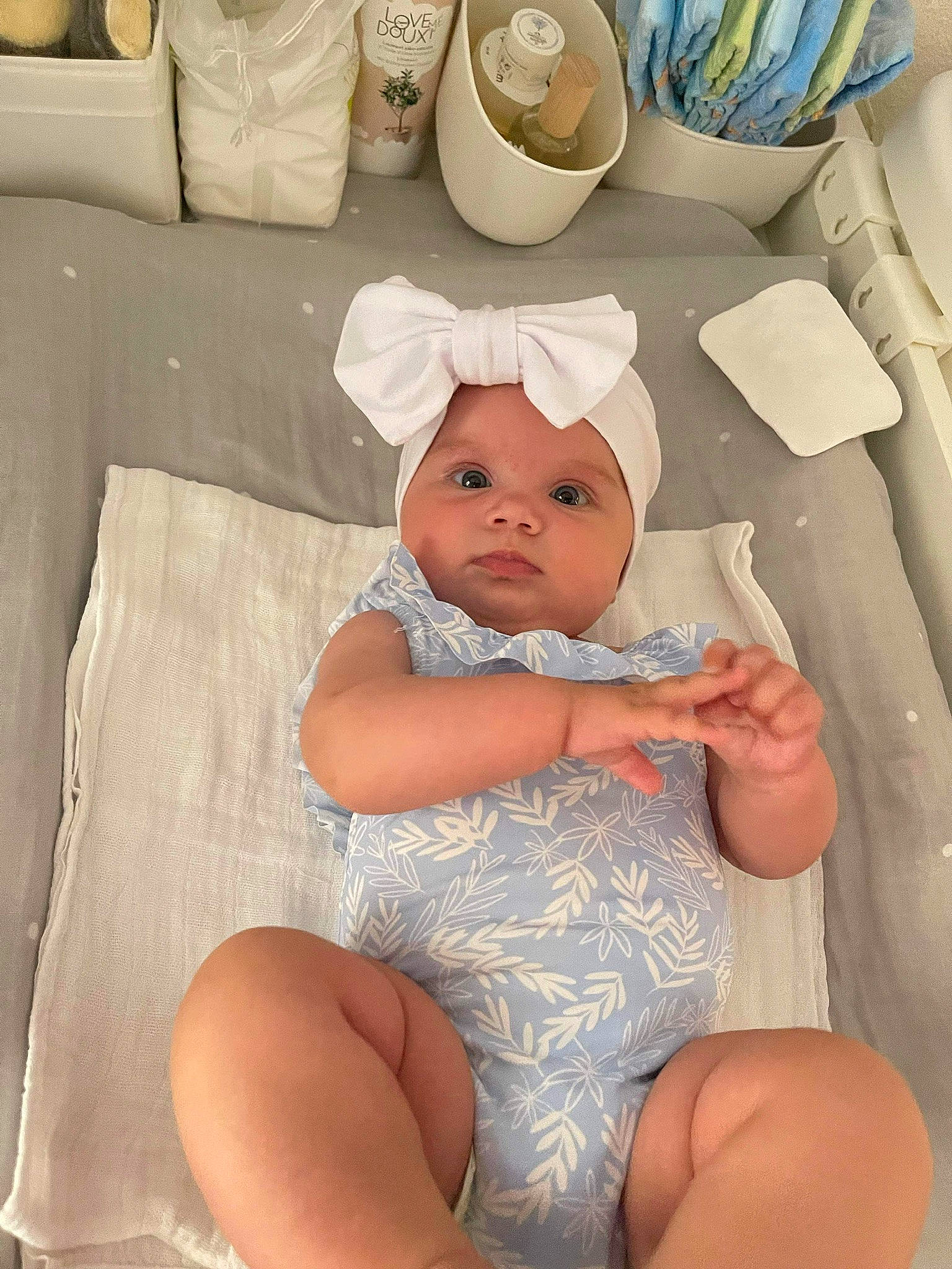 Eleanor participe au concours pour gagner de l'argent avec cette photo : abdomen, baby, baby_products, baby_sleeping, chest, child, comfort, diaper, headgear, headwear, human_leg, knee, linens, person, product, room, sitting, stomach, textile, thigh