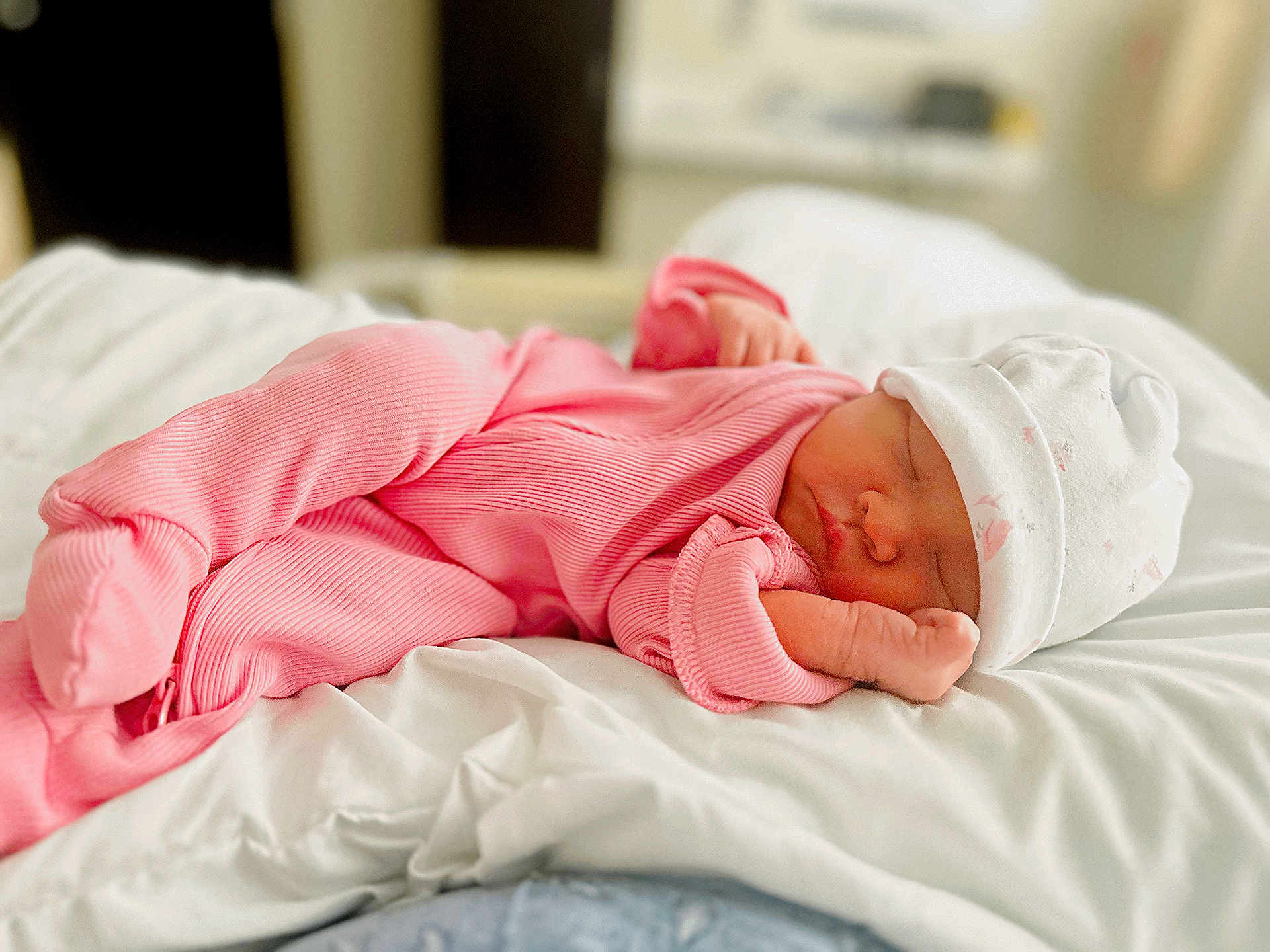 Savannah Cataleya is registered to the contest to win money with this photo: baby, newborn, sleeping, pink_outfit, hat, blanket, bed, infant, cozy, soft, peaceful, resting, cute, child, portrait, indoors, white, comfort, sleep, toddler