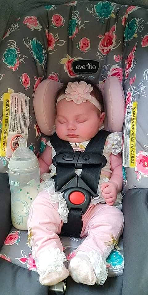 Idalena is registered to the contest to win money with this photo: baby, baby_products, baby_toddler_clothing, carmine, cheek, child, doll, eyelash, fashion_accessory, headwear, magenta, nail, person, pink, plastic, product, rose, sitting, stuffed_toy, textile