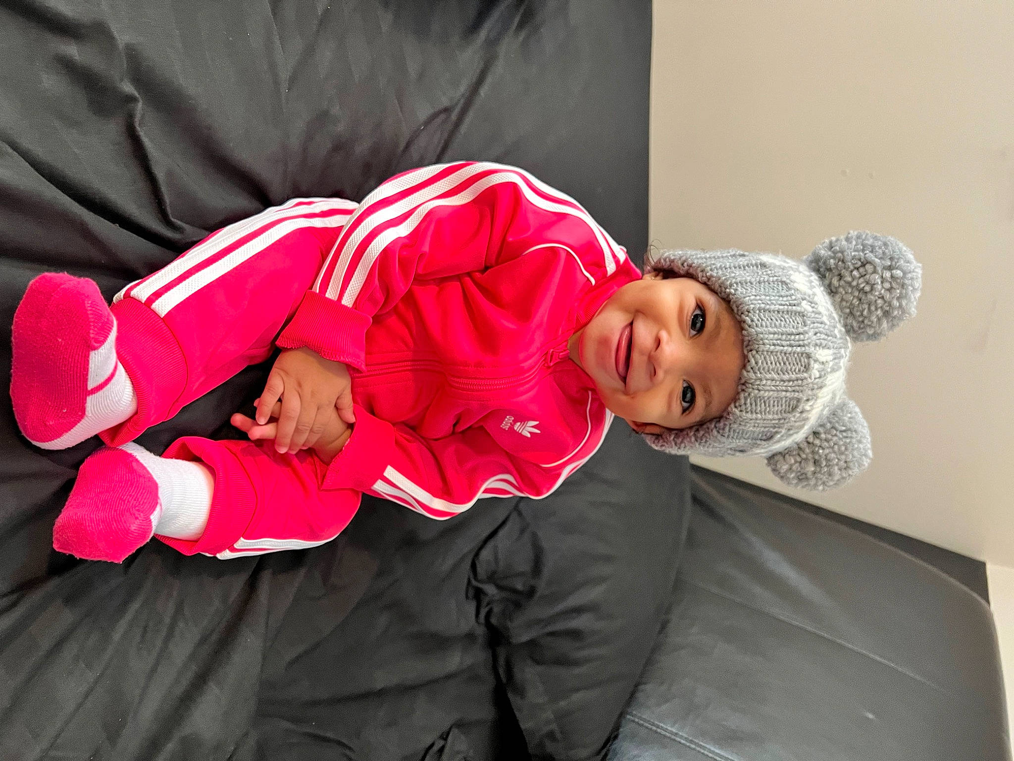 Milah joined the competition — help win amazing prizes! baby, carmine, child, comfort, costume, couch, event, fun, hat, headgear, headwear, joy, knee, leisure, magenta, outerwear, person, sitting, sleeve, sportswear