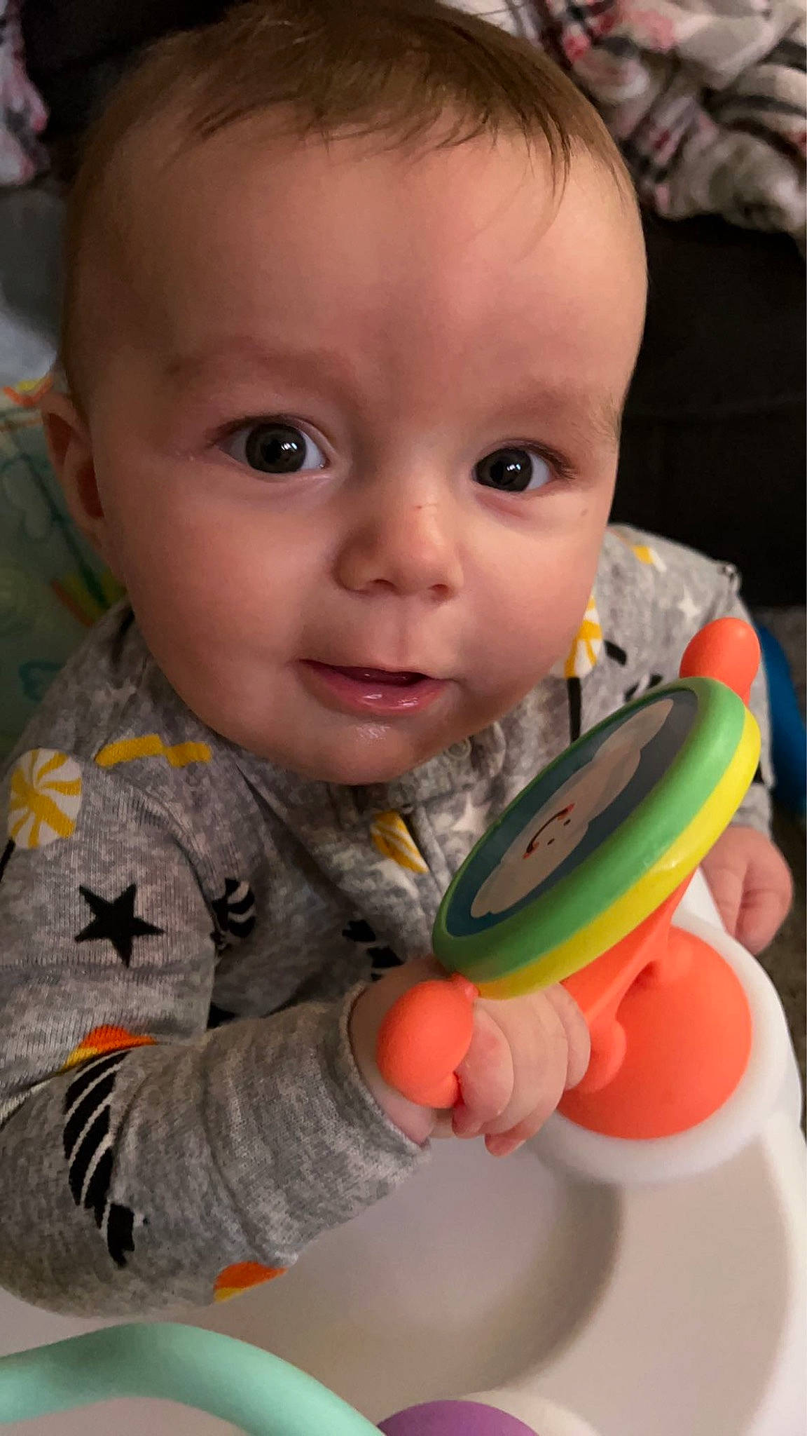 Abel is registered to the contest to win money with this photo: baby, baby_playing_with_toys, baby_toddler_clothing, cheek, chin, close_up, facial_expression, finger, fun, happy, iris, lip, mouth, nose, organ, person, product, skin, sleeve, smile