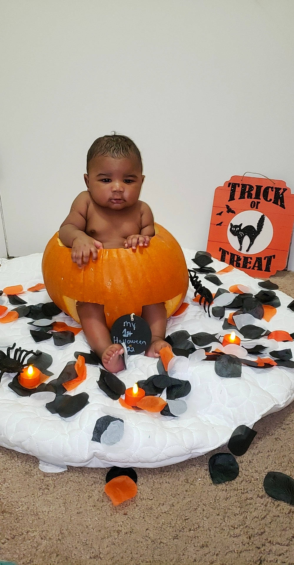 Kyrie is registered to the contest to win money with this photo: baby, brown, calabaza, child, cucurbita, flooring, gourd, local_food, natural_foods, orange, person, plush, pumpkin, squash, stuffed_toy, toddler, toy, trick_or_treat, vegetable, winter_squash