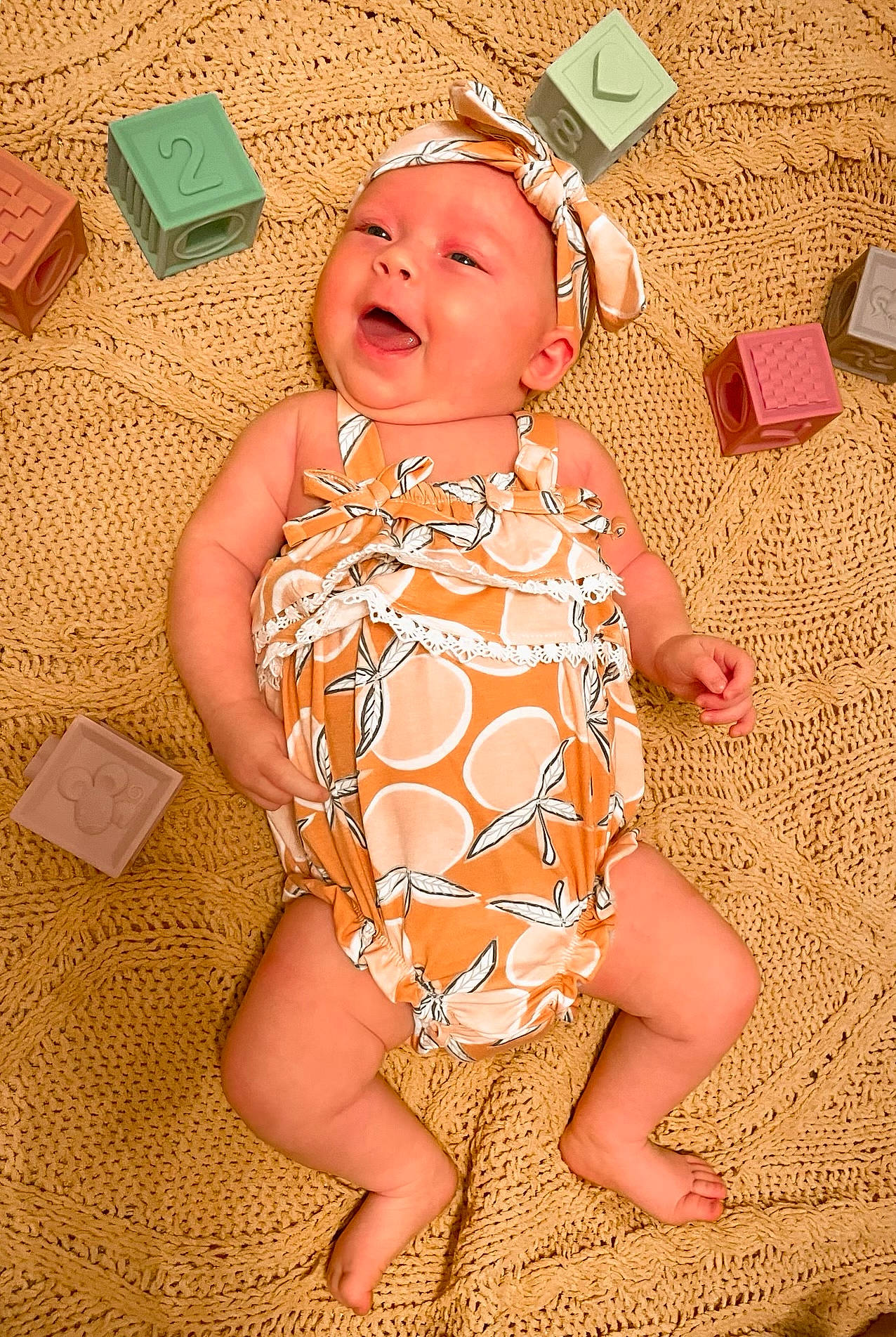 Sutton joined the competition — help win amazing prizes! baby, baby_toddler_clothing, child, day_dress, fashion_accessory, finger, foot, fun, happy, hat, headwear, human_leg, one_piece_garment, pattern, peach, person, pink, sitting, skin, smile