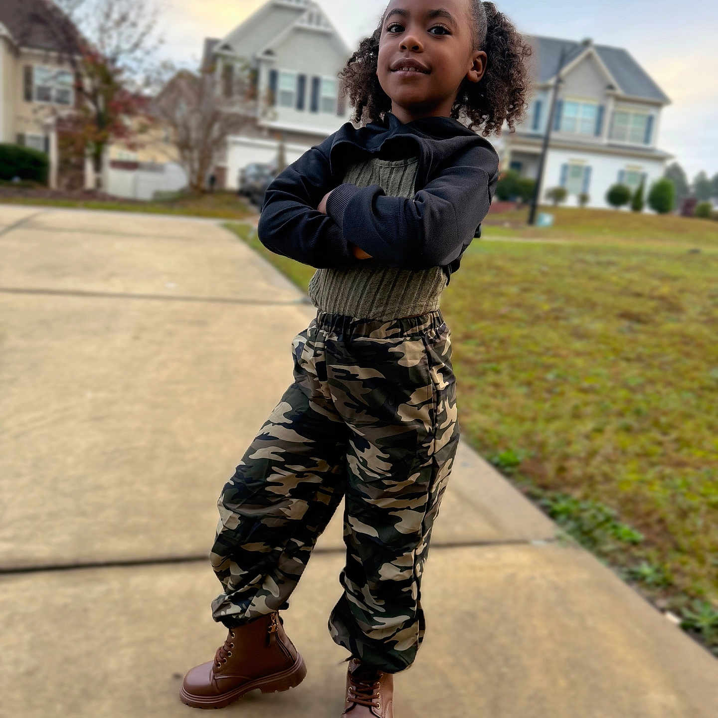 Amaria is registered to the contest to win money with this photo: boy, child, city, clothing, coat, face, footwear, grass, head, jacket, jeans, male, neighborhood, outdoors, pants, person, photography, plant, portrait, shoe