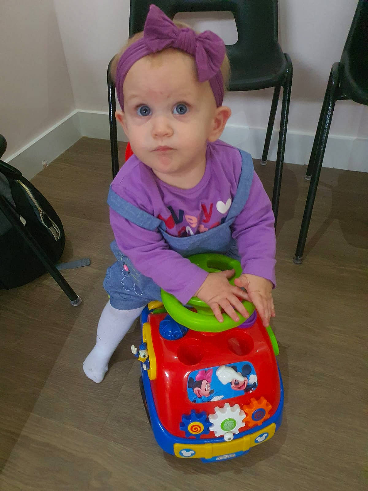 April joined the competition — help win amazing prizes! baby, baby_products, baby_toddler_clothing, baby_toys, bag, chair, cheek, child, cleanliness, floor, flooring, fun, magenta, person, play, purple, riding_toy, sitting, surprise, t_shirt