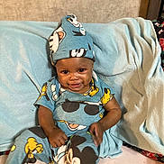 Rosa joined the competition — help win amazing prizes! baby, child, smiling, sitting, blue_outfit, hat, blanket, indoor, cute, happy, person, clothing, cartoon_characters, infant, toddler, face, headwear, cozy, comfort, portrait