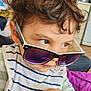 Leo a rejoint le concours — aidez-le/la à gagner de superbes lots ! baby, casual, child, close_up, clothing, curly_hair, cute, expression, eyewear, face, fashion, hand, indoor, person, playful, portrait, skin, striped_bib, sunglasses, young_child
